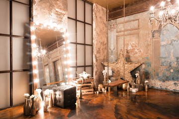 Loft interior with mirror, candles, brick wall, large window, living room, coffee table in modern design