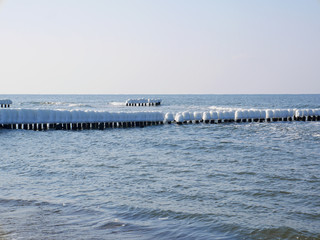 Polish sea in winter with icicles - obrazy, fototapety, plakaty