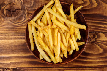 French fries on wooden table