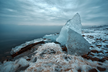 Snow and Frozen Ice Sheets Piled Ashore Windsor Detroit Riverfront