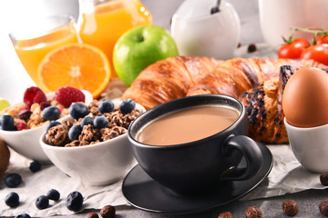 Breakfast served with coffee, juice, croissants and fruits