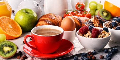 Breakfast served with coffee, juice, croissants and fruits