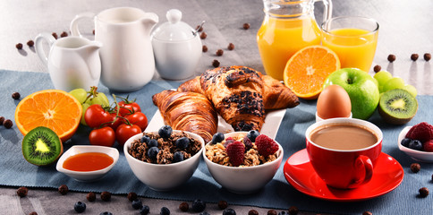 Breakfast served with coffee, juice, croissants and fruits