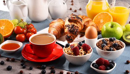 Breakfast served with coffee, juice, croissants and fruits