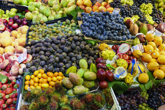 Close-up of various seasonal fruits displayed at a market stall in Porto called Do Bolhao
