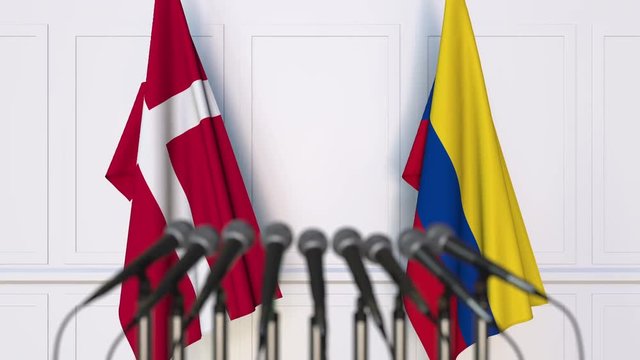Flags of Denmark and Colombia at international meeting or negotiations press conference
