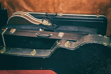 A few Hard Cases for guitars Are At The Wall