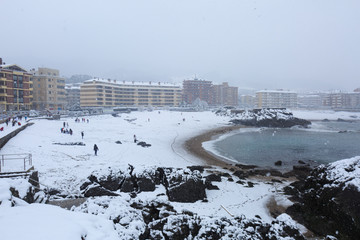 View of the snow-covered beach of Castro Urdiales, Spain, historical image taken on February 28, 2018, an unpublished snowfall for more than 60 years