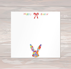 Empty blank for messages or greetings for Easter. Eggs with a pattern in the form of a bunny. Card for the holiday with a rabbit. Vector on wooden background