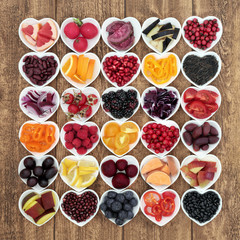 Healthy food with super health promoting properties with fruit and vegetables high in anthocyanins, minerals, antioxidants and vitamins. Foods in purple, red and blue colours denotes anthocyanin.