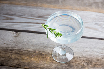 Tasty cocktail with rosemary. Shallow depth of field. Selective focus.