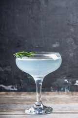 Tasty cocktail with rosemary. Shallow depth of field. Selective focus.