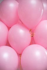 Close-up of helium balloons. Pink round balloons. Texture.