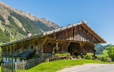 Fototapeta na wymiar Wooden house typical in a alps village on Ridnaun Valley/Ridanna Valley - Racines country - near Sterzing/Vipiteno, South Tyrol, northern italy