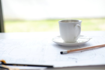 Coffee break with morning time on business table.