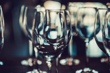 Crystal clear wine glasses at a table ready to be used for red or white wine