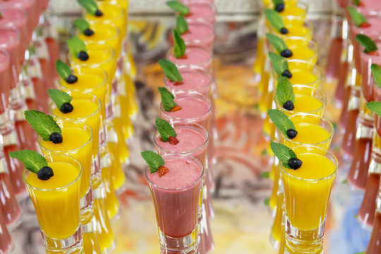 catring colored fruit mousse dessert in glass