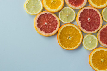 Fototapeta na wymiar Grapefruit, orange and lemon thinly sliced