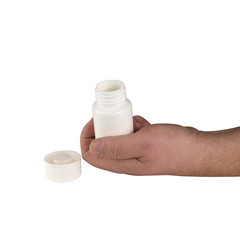 plastikowa butelka po lekach w dłoni