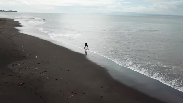 black beach girl on the surf