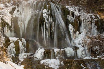 Frozen waterfall in mountains