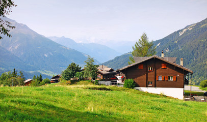 rural landscape with beautiful European farmhouses, a village in Switzerland