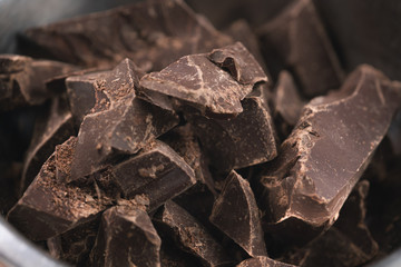 dark chocolate chunks in steel bowl on table
