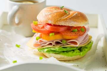 Crisp sandwich with fresh ingredients and tea