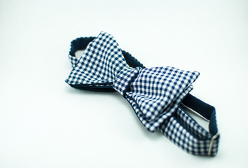 Stylish and well-designed white-black bow tie on a white background; isolated
