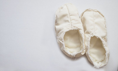 White comfortable slippers isolate on white background. copy space