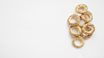 bagels with poppy seeds on white background, copy space