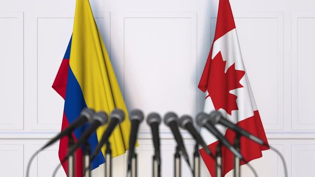 Flags of Colombia and Canada at international meeting or negotiations press conference