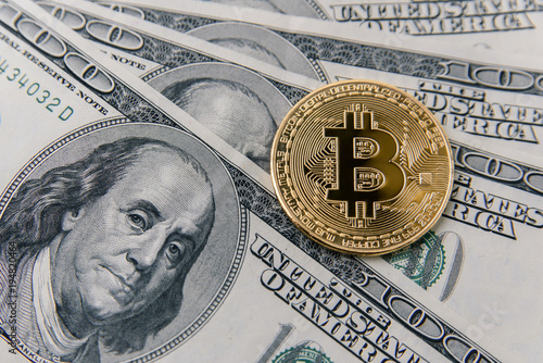Golden Bitcoin Coin On Banknotes Of One Hundred Us Dollar - 