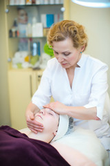 Obraz na płótnie Canvas Cosmetology, face massage.