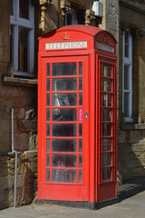 Old red telephone box in Crewkerne, Somerset, England
