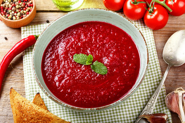 gazpacho soup in a wooden plate