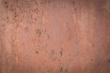 Old peeling paint. Red background. Close-up