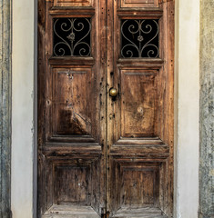 Old wooden door, metallic decoration