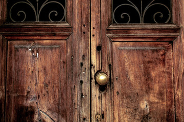 Old wooden door, metallic decoration, close-up