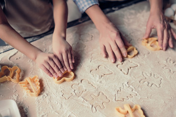 Grandmother and granddaughter cooking on kitchen
