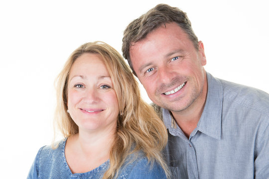 Portrait of forties couple smiling on white background
