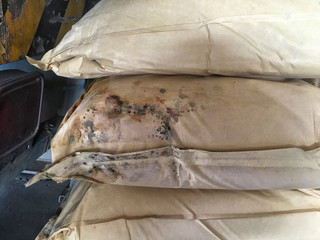 Reject quality of Brown Paper ingredient bag wet and moldy in damage warehouse storage