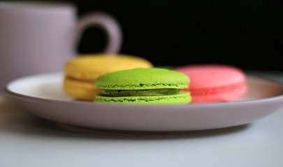 Colorful macaron and a cup of drink