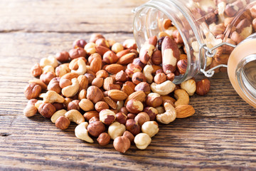 mixed nuts on wooden table