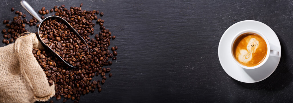 cup of coffee and coffee beans in a sack, top view © Nitr