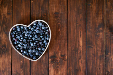 Top view of blueberry on dark wooden background