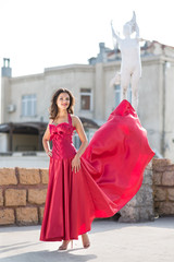 Obraz premium Beautiful woman in a red dress