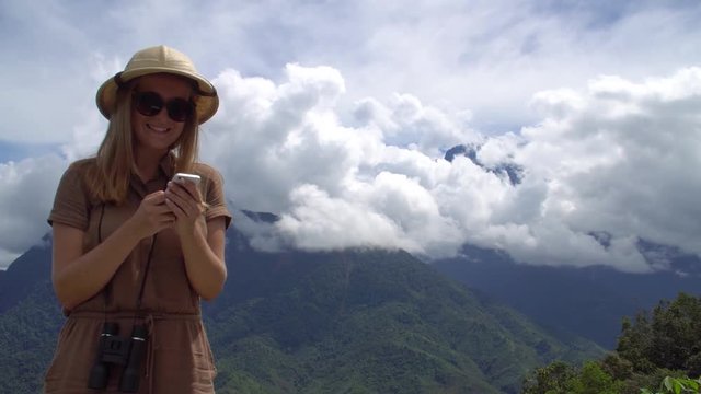 Young Female Traveler Texting in Mobile Phone