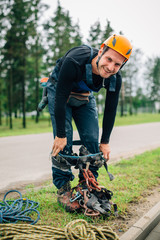 Industrial alpinist preparing to the work