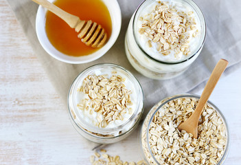 Vitamin Healthy Breakfast Yogurt with Oat Flakes White Wooden Background Porridge Glass Jar Useful Food 